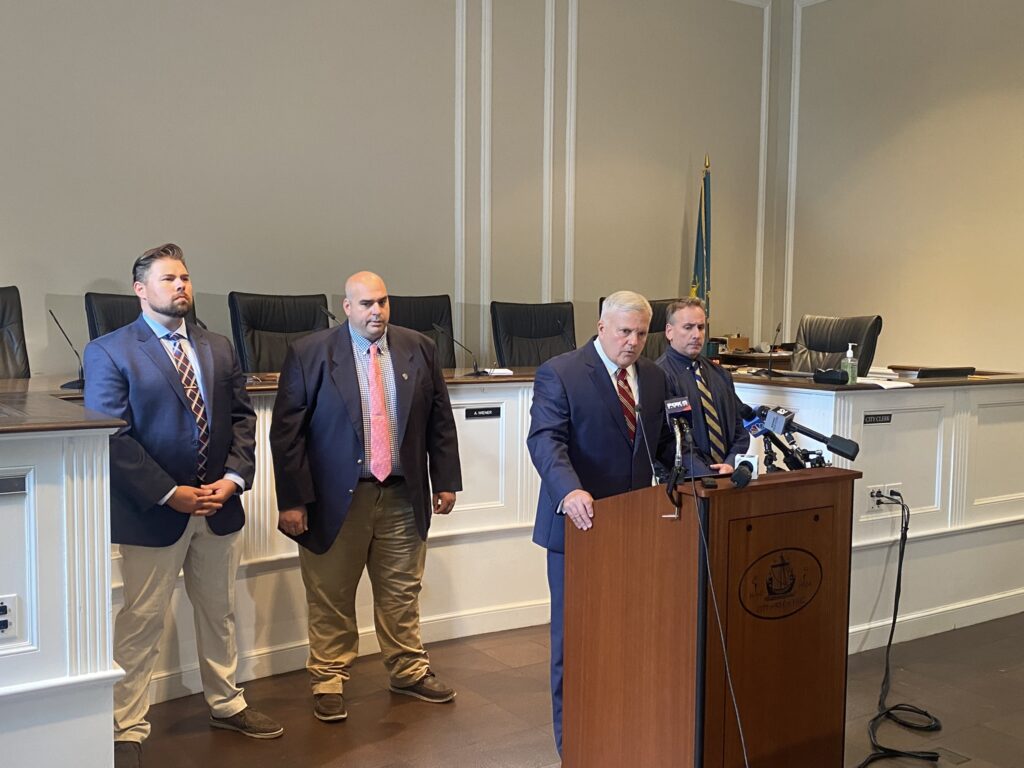 (PHOTO: City of Rye Public Safety Commissioner Mike Kopy at the PD briefing on the Rye Town Park assault held June 26, 2023 at Rye City Hall. Behind Kopy is Detective Jon Klein, Detective Mike Anderson and Detective Mike Anfuso.)