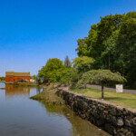 (PHOTO: The iconic red Tide Mill house, part of the Tide Mill Yacht basin. Credit: Sierra Desai.)