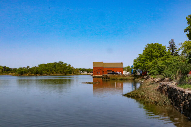 (PHOTO: The iconic red Tide Mill house, part of the Tide Mill Yacht basin. Credit: Sierra Desai.)