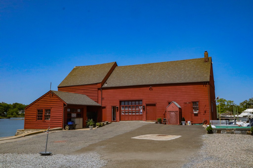 (PHOTO: The iconic red Tide Mill house, part of the Tide Mill Yacht basin. Credit: Sierra Desai.)