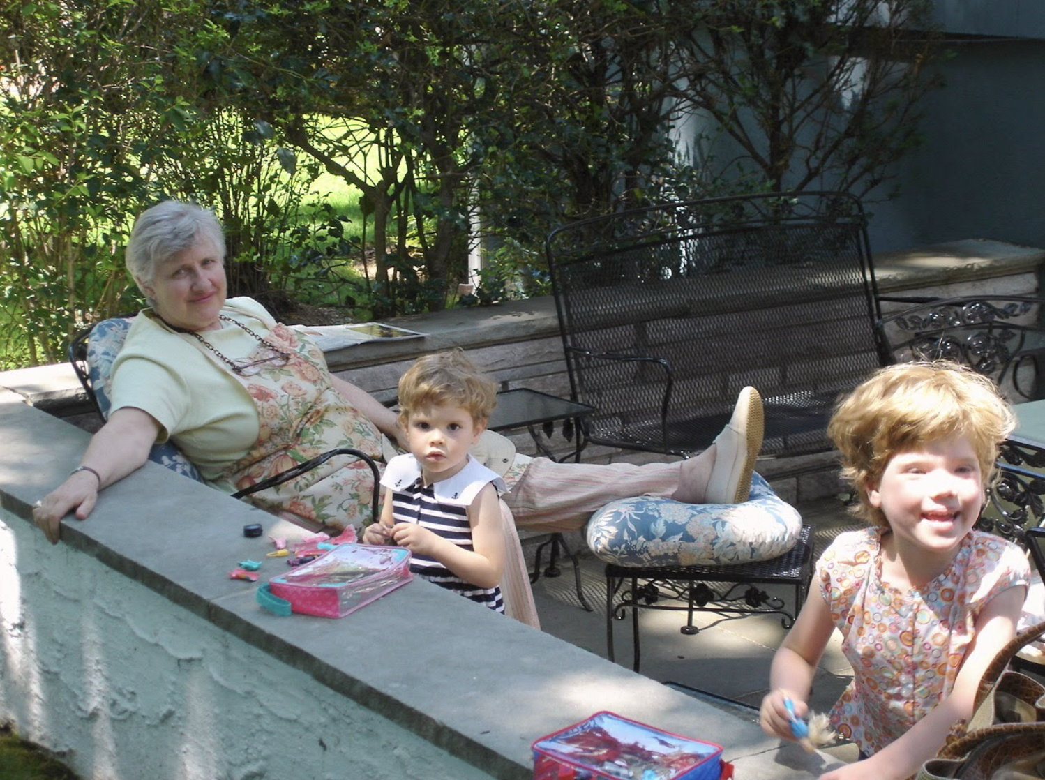 (PHOTO: Sally Lee sitting with her granddaughters, Beatrice and Madeleine Larzul, in the Allendale Drive house on July 31st, 2007.)