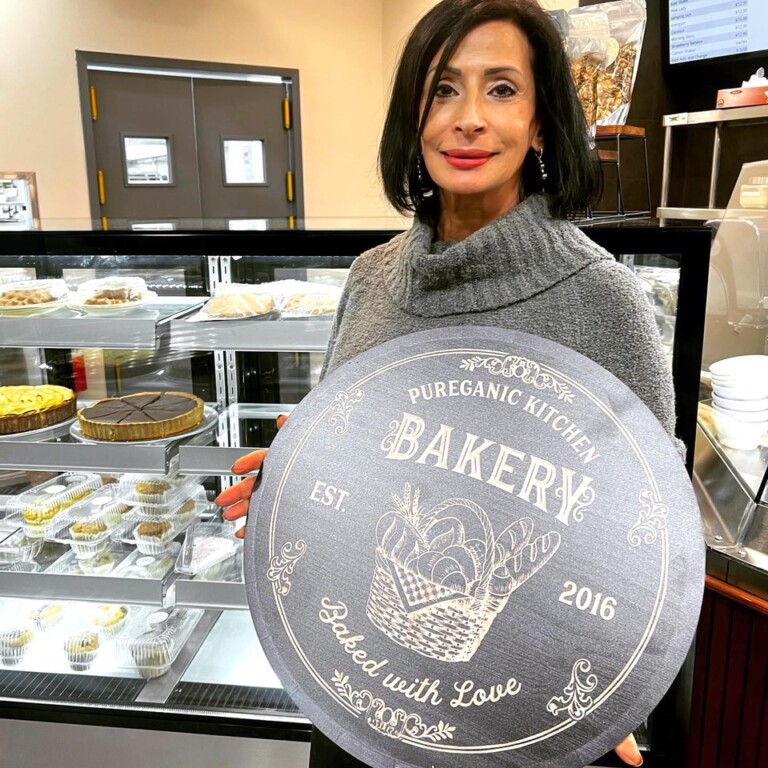 (PHOTO: Owner Moshira Soliman standing in front of the bakery of the Pureganic Cafe.)