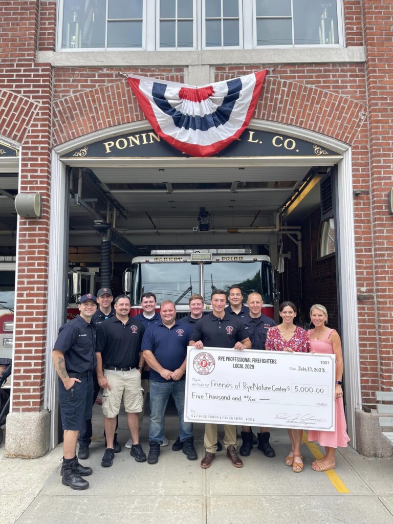 (PHOTO: Rye Professional Firefighters Local 2029 presented $5,000 to Christine Siller and Caitlin Layng of Friends of Rye Nature Center.)