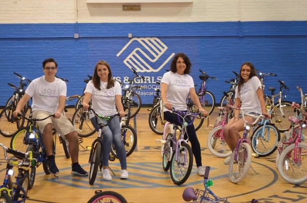 (PHOTO: Linking Handlebars Bike Giveaway at Boys and Girls Club of New Rochelle in June, 2017: (From L to R) Luca Villani, Co-President; Lucia Villani, Co-Founder and Co-President; Adriane DeFeo, Director; Cristiana Villani, Co-founder and Vice President)