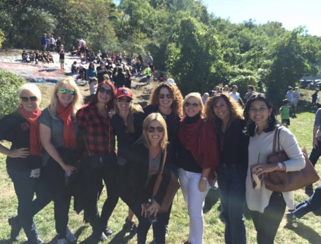 (PHOTO: Kerry's 30th reunion at the Rye Harrison Game 2015. From left to right, Dawn Dalhgren Berrocal, Jeanne Lavelle Russo, Debbi Pearlman, Deidre Maloney Burbank, Linda Mascali Cassano (front) Lori Bring Olbrys, Me Kerry Ann Taylor Christensen, Kimberly Mancus Macchia, and  Rassamee Jaigla Martini Donati. All were cheerleaders together at RHS.)