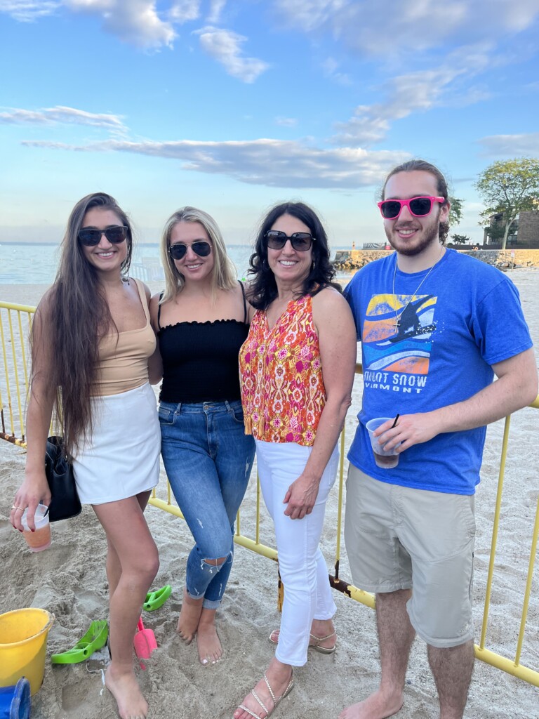 (PHOTO: Adriane and family at Barley's Beach House Event on Oakland Beach in June, 2023)