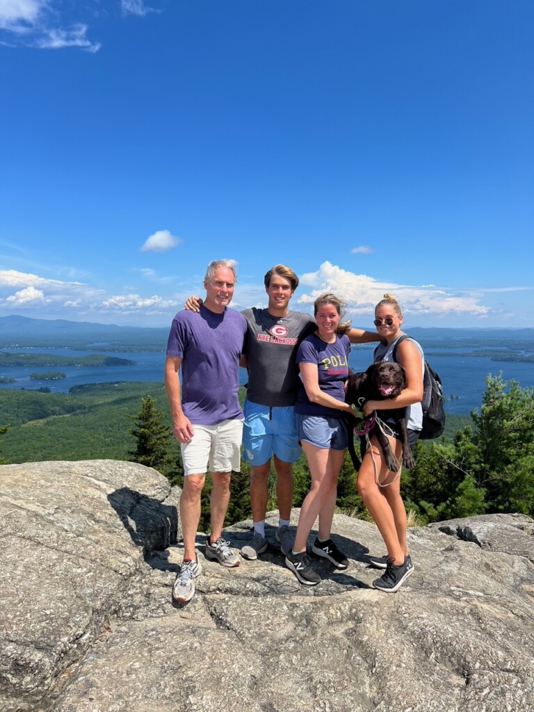 (PHOTO: Rye City Council candidate Keith Cunningham, son Aidan, wife Nicole, and daughter Amelia along with their chocolate lab Sadie on a morning hike up Mt. Major near their home on Lake Winnipesaukee in New Hampshire.)