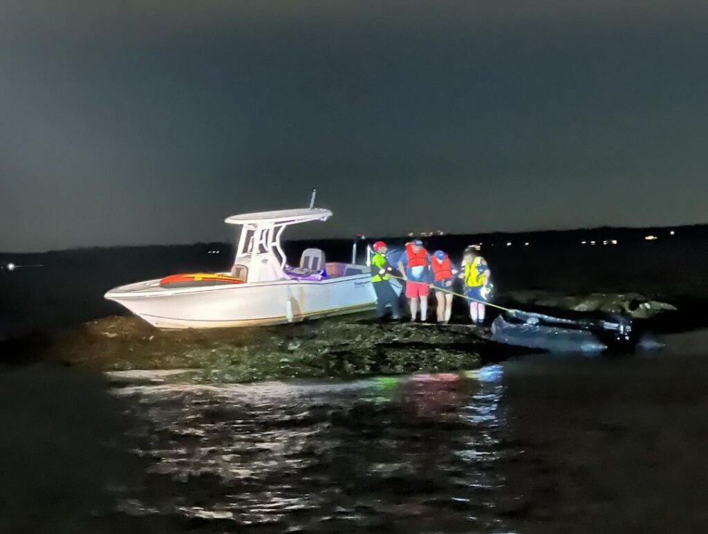 (PHOTO: A Rye FD inflatable rescue boat with Firefighter Ryan Iarocci and Firefighter Cea Fong approaches a boat from the Carefree Boat Club's Rye Boat Basin location with two individuals aboard that ran aground on the rocks off the Shenorock Shore Club on Milton Point on Wednesday, August 23, 2023.)
