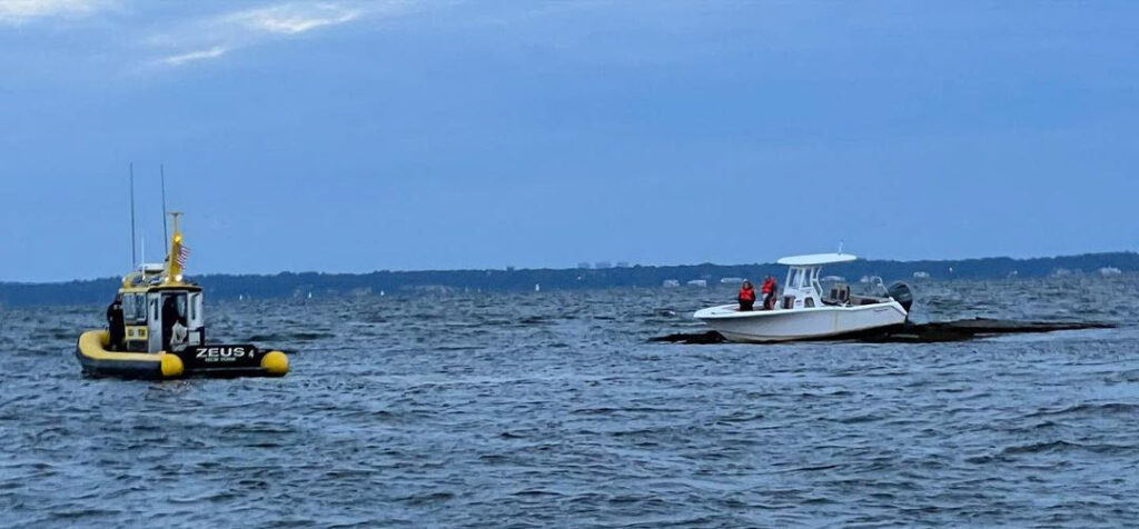 (PHOTO: Sea Tow of Mamaroneck approaches a boat from the Carefree Boat Club's Rye Boat Basin location with two individuals aboard that ran aground on the rocks off the Shenorock Shore Club on Milton Point on Wednesday, August 23, 2023.)
