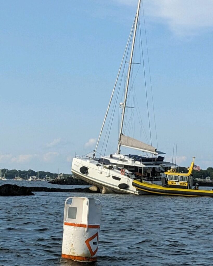 (PHOTO: A catamaran with the name Next Wave 2.0 that was under power ran aground on the Scotch Caps rocks just off American Yacht Club on Thursday, August 30, 2023.)