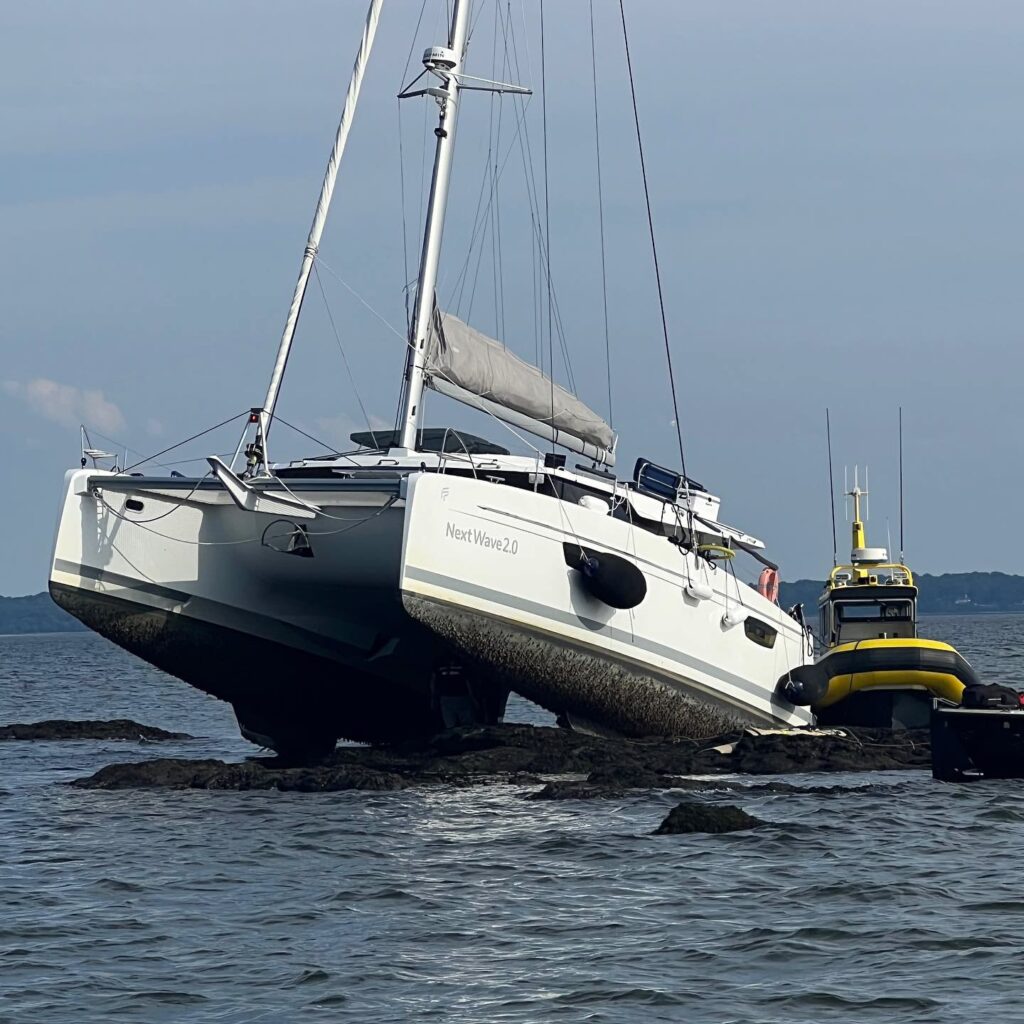 (PHOTO: A catamaran with the name Next Wave 2.0 that was under power ran aground on the Scotch Caps rocks just off American Yacht Club on Thursday, August 30, 2023.)