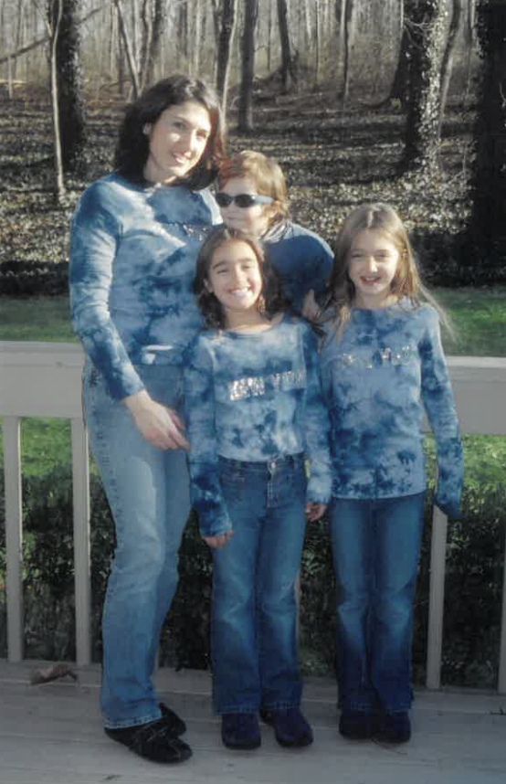 (PHOTO: Adriane and family in the backyard of house on Theodore Fremd Ave in 2004)