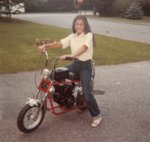 (PHOTO: A different kind of biking! -- Adriane on a motorbike on Eldredge Court in 1979)