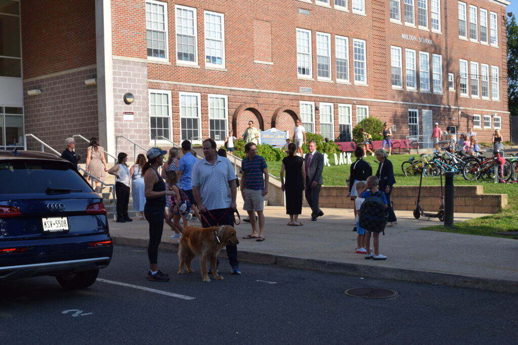 (PHOTO: Parents and dogs dropping off students at Milton Elementary on the first day of school 2023.)