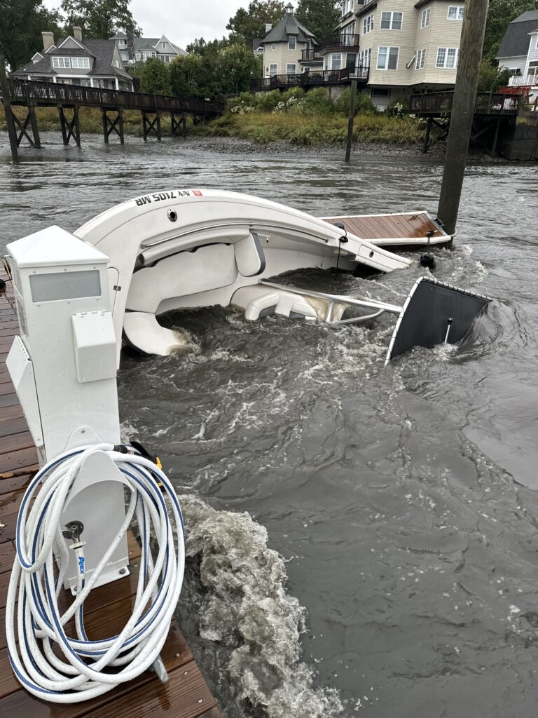 (PHOTO: The boat in the Rye Marine did not make it through our flooding event. It was found in bad shape Sunday morning by Rye PD.)