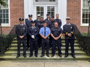 (PHOTO: New Rye Fire Fighter Brandon Antolino with the rest of Rye FD on the steps of Rye City Hall after his swearing in on September 26, 2023.)