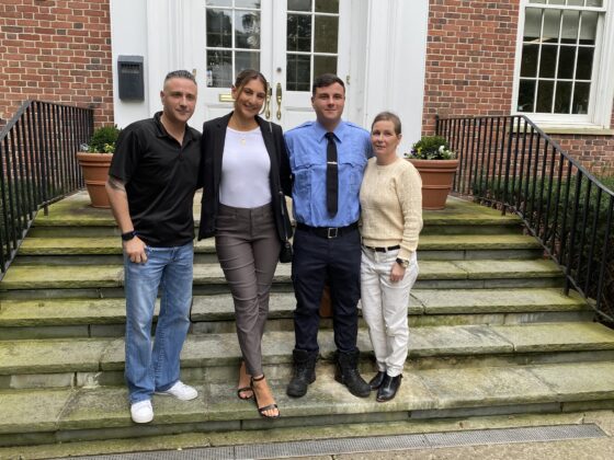 (PHOTO: Rye Fire Fighter Brandon Antolino with his father Frank, girlfriend Kristen Corso and mother Nicole on the steps of Rye City Hall after his swearing in on September 26, 2023.)