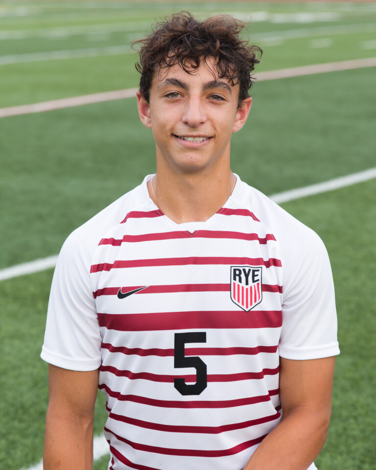 (PHOTO: Rye Boys Varsity Soccer player Chase Pepper (#5) contributed an assist on a Charlie Margiloff goal in the 37th minute versus Woodlands on Tuesday, September 26, 2023. Credit: Aileen Brown.)