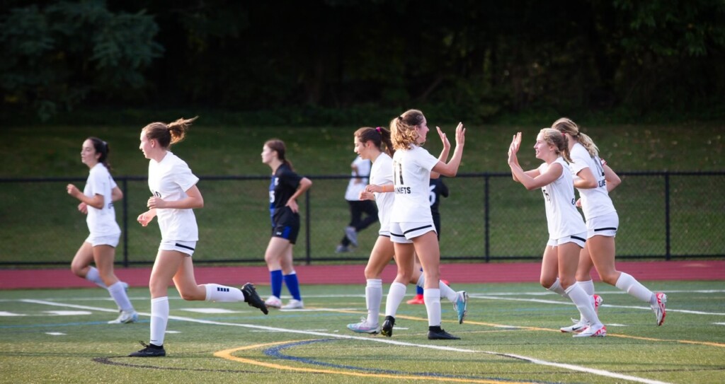 (PHOTO: Rye Girls Varsity Soccer teammates Charlotte and Lyla Keenan celebrating together.)