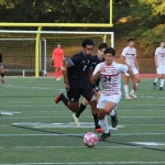 (PHOTO: Alex Rojas (#24) drives forward with the ball during the Rye Boys Varsity Soccer game at Edgemont on Tuesday, October 3, 2023. Credit: Alvar Lee.)