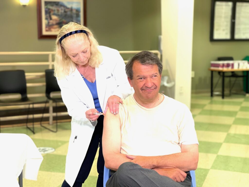 (PHOTO: Urging others to do the same Rye guy and County Executive George Latimer rolled up his sleeves for a flu shot and an updated COVID-19 vaccine this past Friday.)