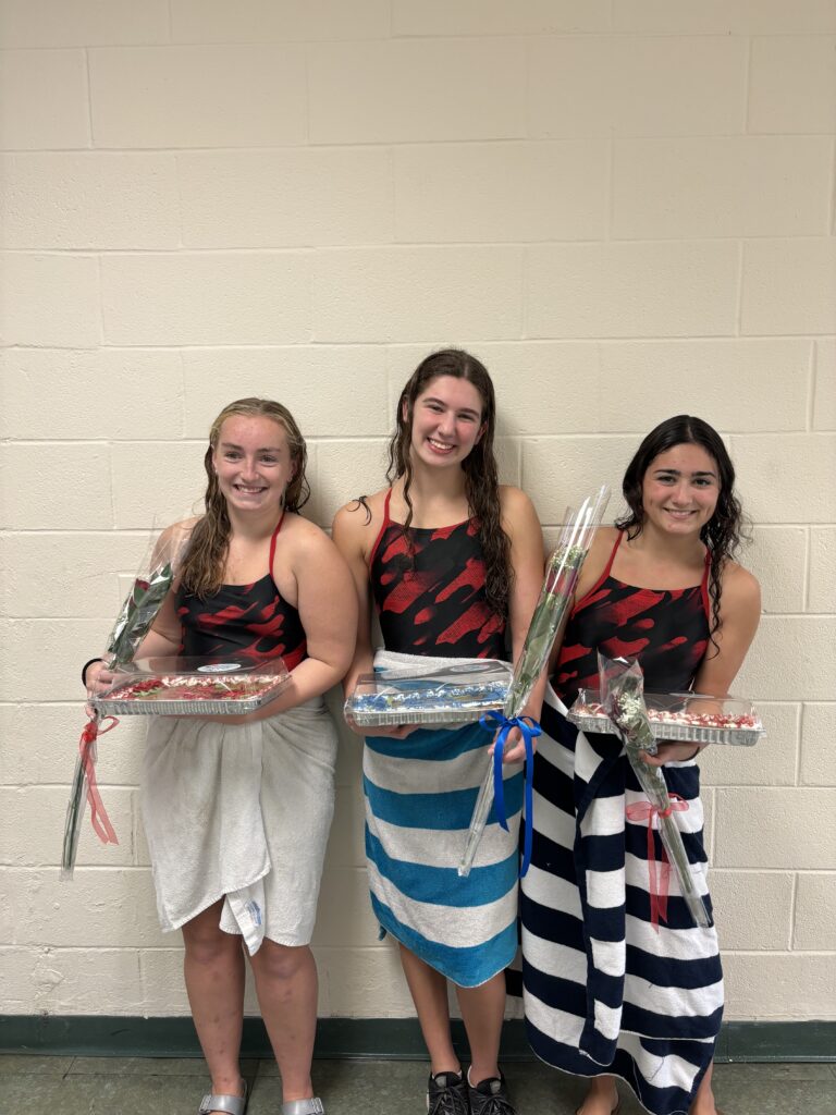 (PHOTO: The 2023 Rye Girls Swimming and Diving senior captains Delia Fuchs (Rye), Sydney Goldberg (Blind Brook), and Lilly Peters (Rye).)