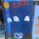 (PHOTO: Local merchants offered their windows and local artists and their parental supervisors went to work during the 70th Annual Halloween Window Painting on Purchase Street on Sunday, October 22, 2023.)