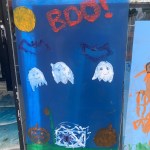 (PHOTO: Local merchants offered their windows and local artists and their parental supervisors went to work during the 70th Annual Halloween Window Painting on Purchase Street on Sunday, October 22, 2023.)