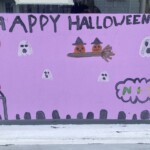 (PHOTO: Local merchants offered their windows and local artists and their parental supervisors went to work during the 70th Annual Halloween Window Painting on Purchase Street on Sunday, October 22, 2023.)