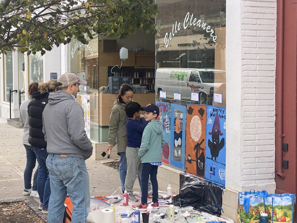 (PHOTO: Local merchants offered their windows and local artists and their parental supervisors went to work during the 70th Annual Halloween Window Painting on Purchase Street on Sunday, October 22, 2023.)