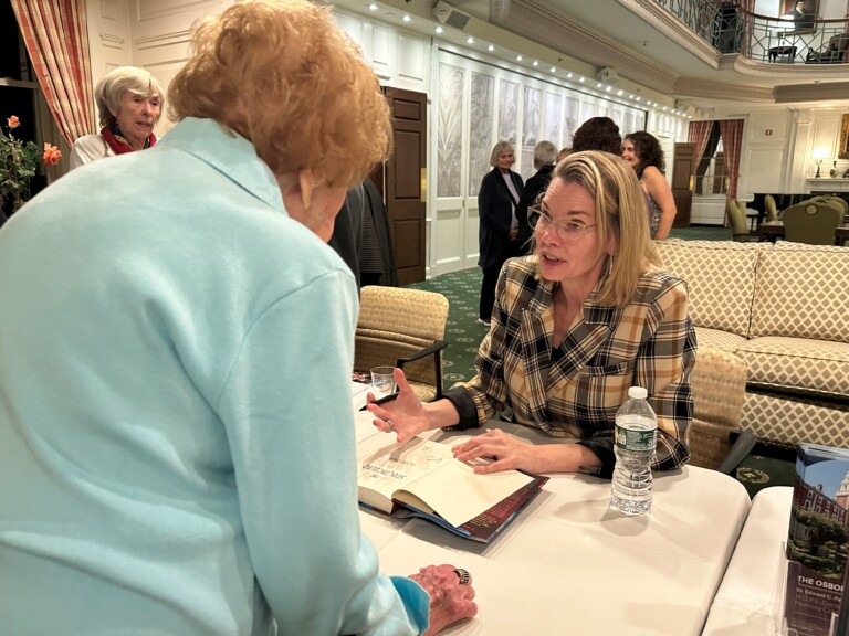 (PHOTO: New York Times best-selling author Fiona Davis signed books at The Osborn on Thursday, October 19, 2023.)