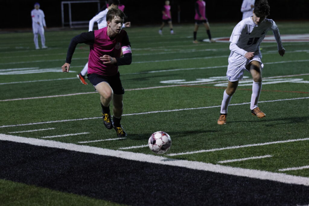 (PHOTO:  Rye Boys Varsity Soccer player Kieran Traynor played a strong 80 minutes in the center of the midfield.)