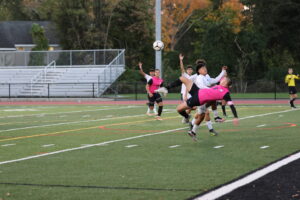 (PHOTO: Rye Boys Varsity Soccer player Tommy Broderick attempts a bicycle kick in the first half against Lakeland.)