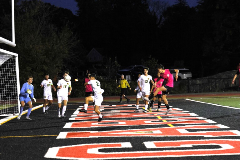 (PHOTO: Rye Boys Varsity Soccer Kasen Scarperi scores the first goal of the match to give the Garnets a 1-0 lead in the 47th minute.)