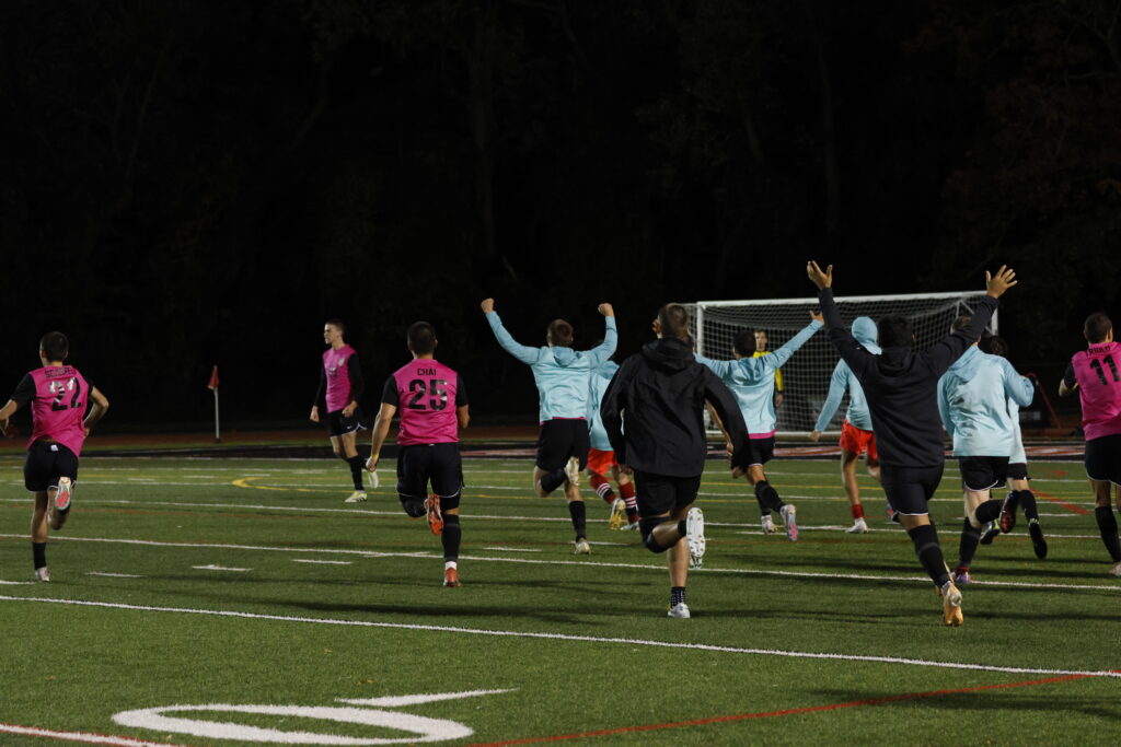 (PHOTO: The Garnets rush the field after prevailing 3-1 in penalties against Lakeland in the Section 1 Quarterfinals.)