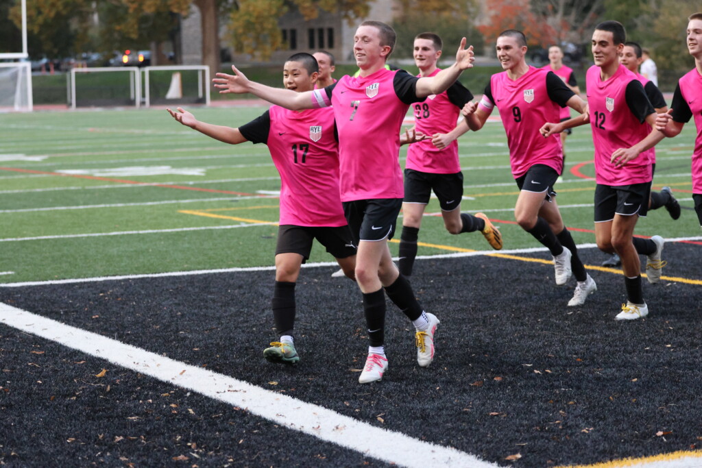 (PHOTO: Rye Boys Varsity Soccer player Ollie Lincoln and the lads celebrate Ollie's masterful goal that put the Garnets up 3-0.)