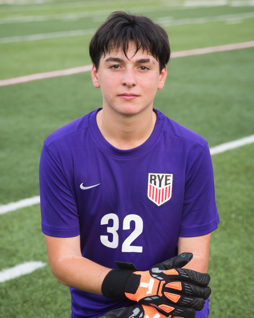 (PHOTO: Rye Boys Varsity Soccer goalie #32 Martin Fields made one save to help Rye post a shutout. Credit: Aileen Brown.)