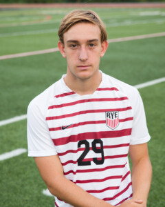 (PHOTO: Rye Boys Varsity Soccer player #29 Zac Ramsey put in a strong shift in the backline and earned an assist on Kearney's goal. Credit: Aileen Brown.)