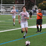 (PHOTO: At Rye Boys Varsity Soccer on Saturday versus Yorktown, Lex Cox vied for the ball. Credit: Alvar Lee.)