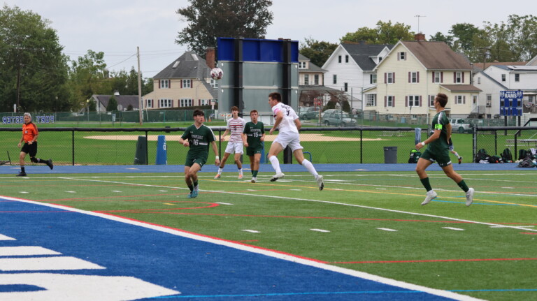 (PHOTO: At Rye Boys Varsity Soccer on Saturday versus Yorktown, Tommy Broderick headed the game's first goal. Credit: Alvar Lee.)