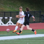 (PHOTO: Sjef Smits (#8) plays a pass down the sideline during the Rye Boys Varsity Soccer game at Edgemont on Tuesday, October 3, 2023. Credit: Alvar Lee.)