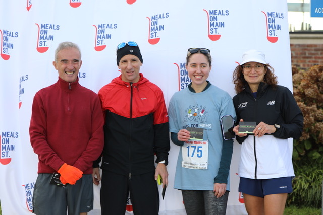 (PHOTO: At the 2023 annual Miles for MOMS (Meals of Main Street) race: 5k race winners, from left to right, Conor O’Driscoll (2nd place), Jonathan Frieder (1st place), Madeline Bird (1st place), and Christine Vincent (2nd place).)