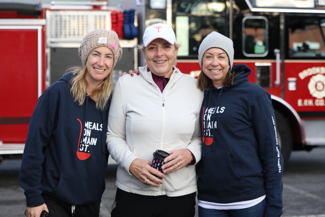 (PHOTO: At the 2023 annual Miles for MOMS (Meals of Main Street) race: Rye resident and Meals on Main Street (MOMS) Program Development Manager, Denise Cypher, is flanked by her Rye neighbors and MOMS Board members, Cameron Scansaroli and Jennifer Molloy.)