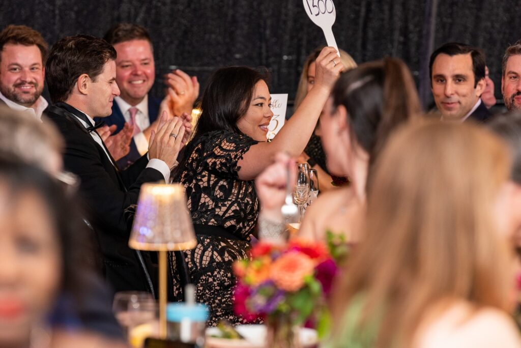 (PHOTO: The annual Jay Soirée helped raise $100,000 towards a successful $1.25 million campaign at the Jay Heritage Center. At the soirée: Josie Cassin successfully bids on Max Tucci’s Boulder, Colorado home.)