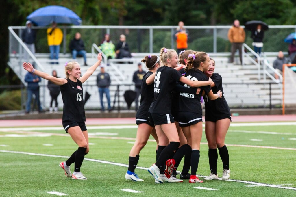 (PHOTO: Rye Girls Varsity Soccer advanced the the quarter finals after a rainy day win over Walter Panas on Saturday. Credit: Aileen Brown.)