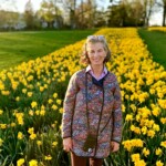 (PHOTO: Chris Duncan of Little Garden Club of Rye, who had the idea for the daffodils in Rye Town Park.)