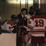 (PHOTO: Rye Lifer and Rye Boys Varsity Hockey Coach Peter Thomas giving Instructions to Tommy O'Brien during a Rye Varsity game in 2016.)