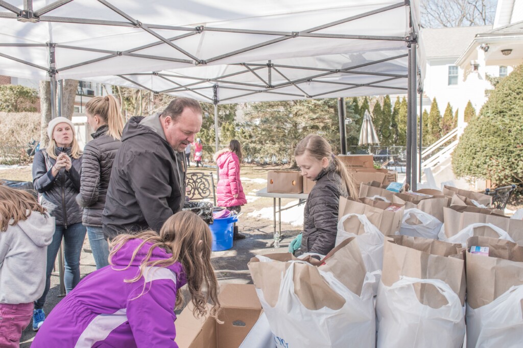 (PHOTO: Pastors Pasquale Falco of Giving Tree Global “Bread of Life” and volunteers at the food pantry.)