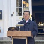 (PHOTO: Rye Mayor Josh Cohn delivers remarks during the Veterans Day ceremony on the Rye Village Green November 11, 2023.)