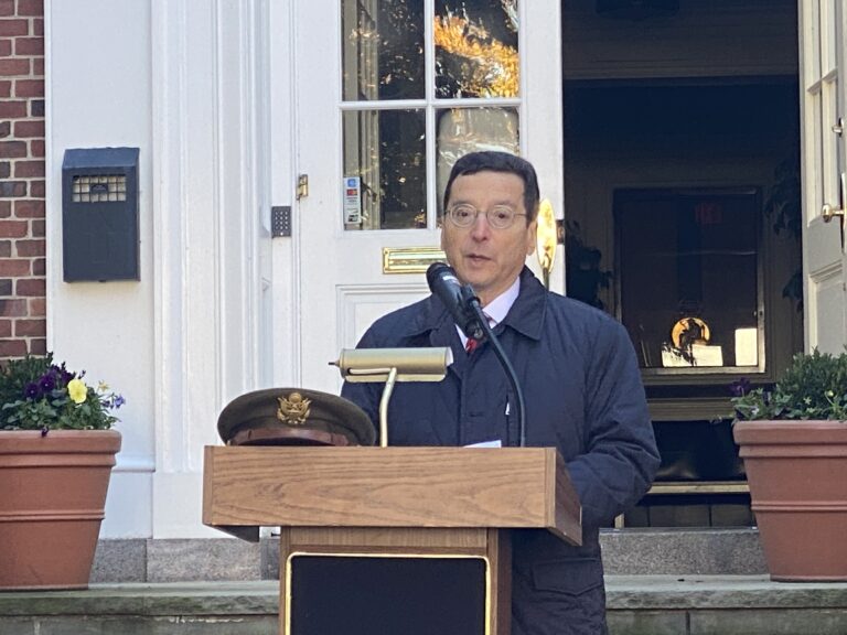 (PHOTO: Rye Mayor Josh Cohn delivers remarks during the Veterans Day ceremony on the Rye Village Green November 11, 2023.)